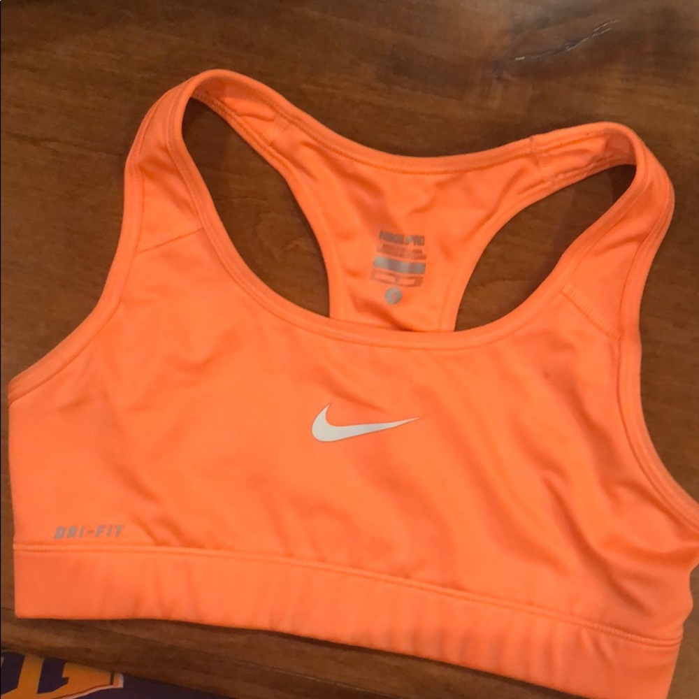Nike orange sports bra . Worn once withsmall mark